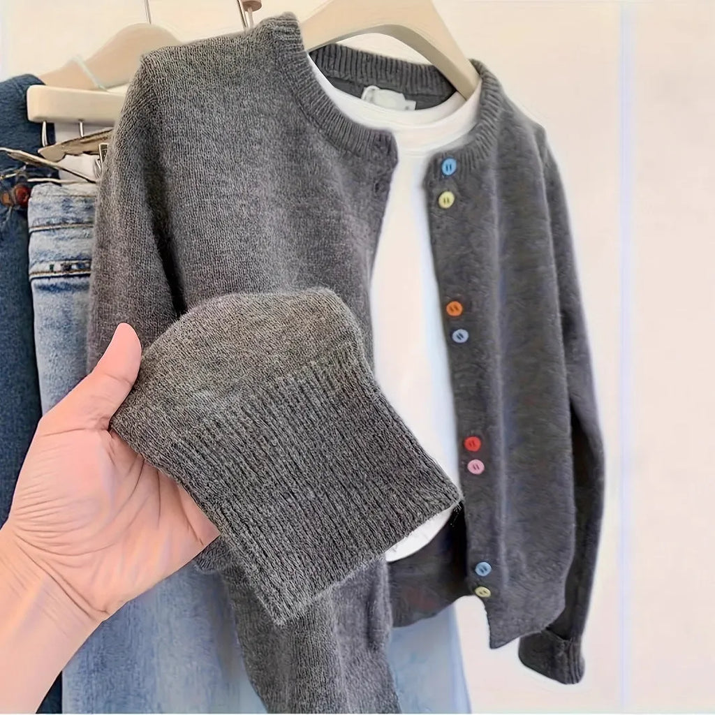 Women's dark grey button-front polyester cardigan sweater on a hanger.
