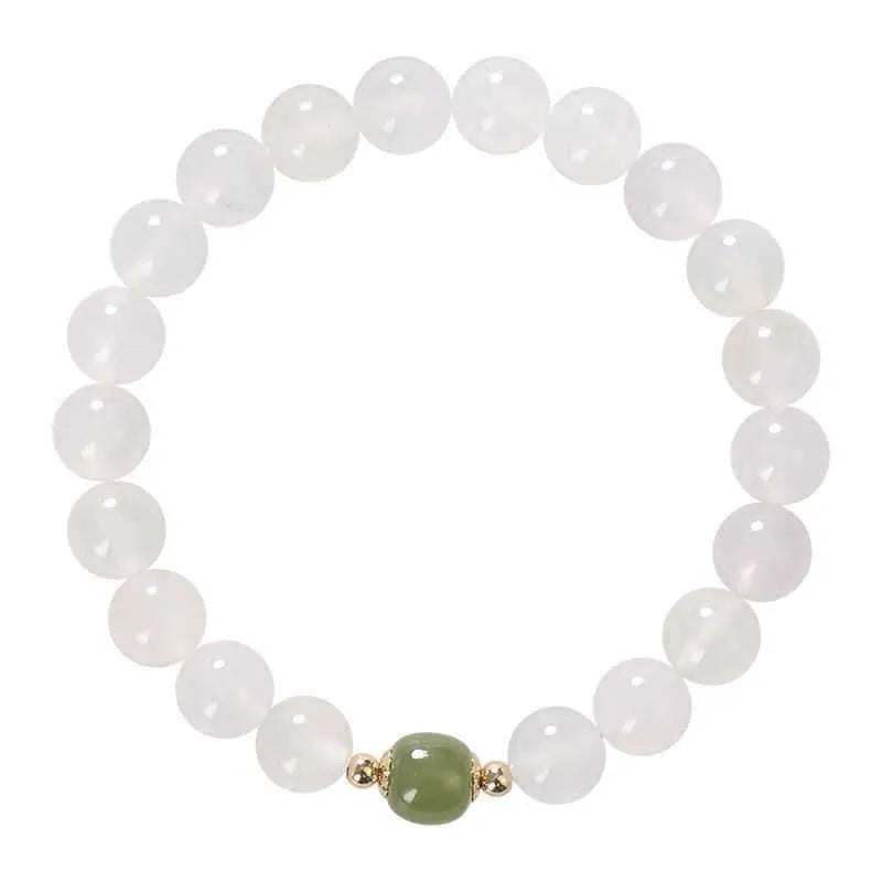 Handmade white agate bracelet with Hetian jade details and cinnabar inlays in 6mm and 8mm bead sizes