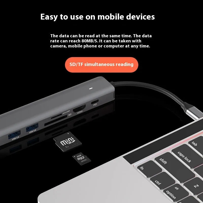 LQT-LH07 7-in-1 USB-C PD charging and card reader hub for laptops on a desk.