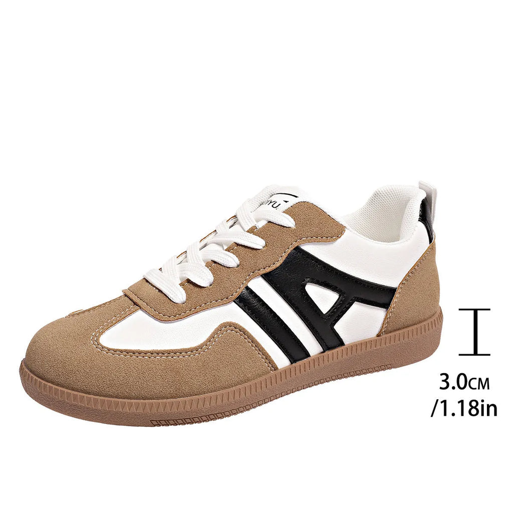 Women's retro colour matching lace-up jogging shoes in black, showing low-top design and platform heel.