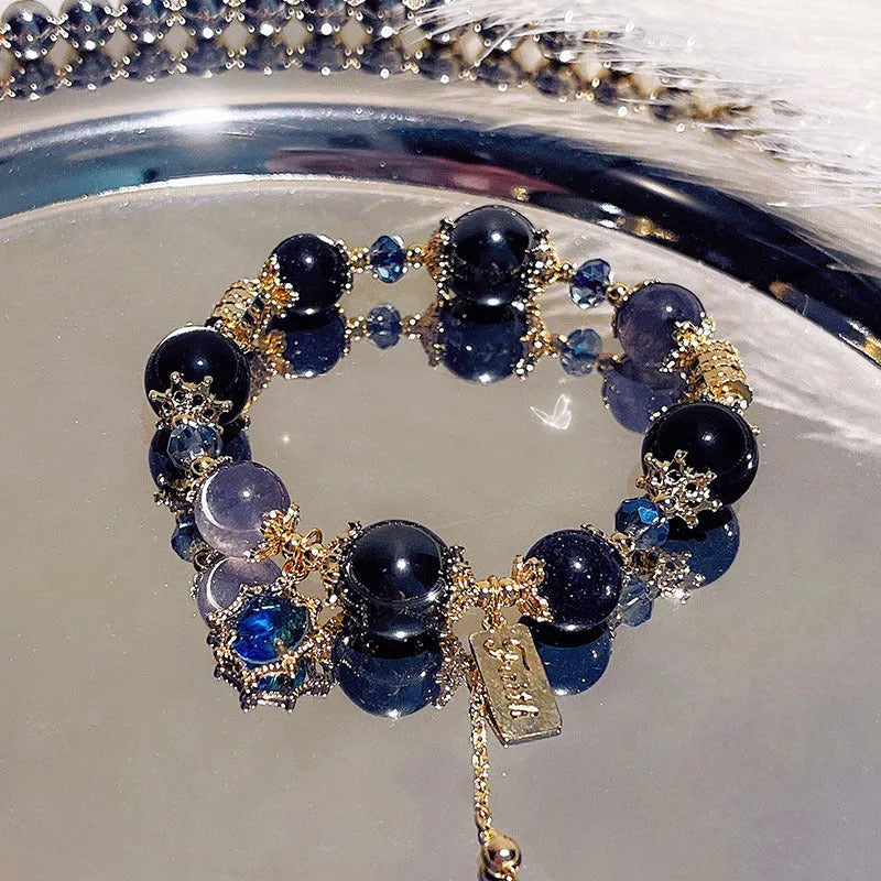 Women's galaxy colour bracelet with snowflake pendant and bow design on heart-shaped alloy base