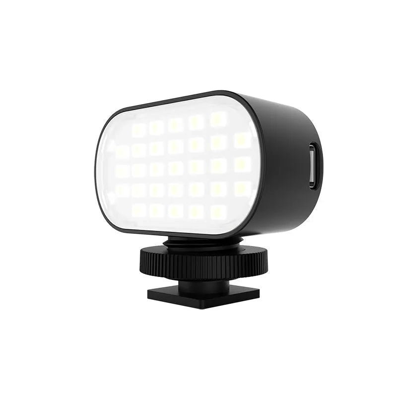 ST-30 black mobile phone fill light with colour palettes and cold shoe mount for photography