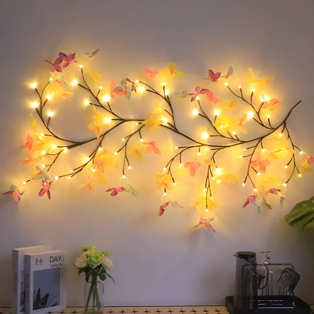 Flexible LED butterfly tree rattan lamp shaped into a decorative spiral, showing USB cable and lit white LEDs.