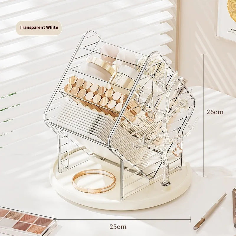 Clear plastic rotating makeup storage box organiser with 360-degree spin base on a dressing table.