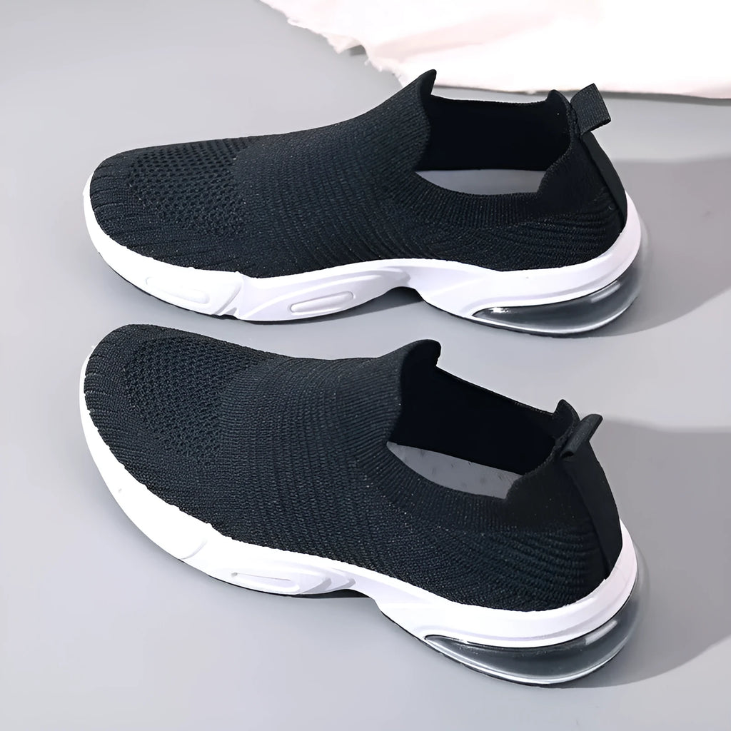 A pair of low-top slip-on sock shoes in a choice of colours, showing the mesh lining and lightweight PVC sole.