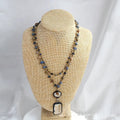 Two-layer tribal necklace with glass pendant and natural stone elements on adjustable chain