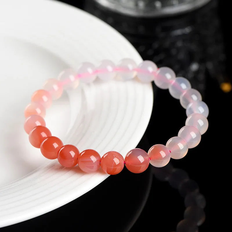 Natural gradient Yanyuan agate bracelet showing geometric beads in a salt source colour tone.