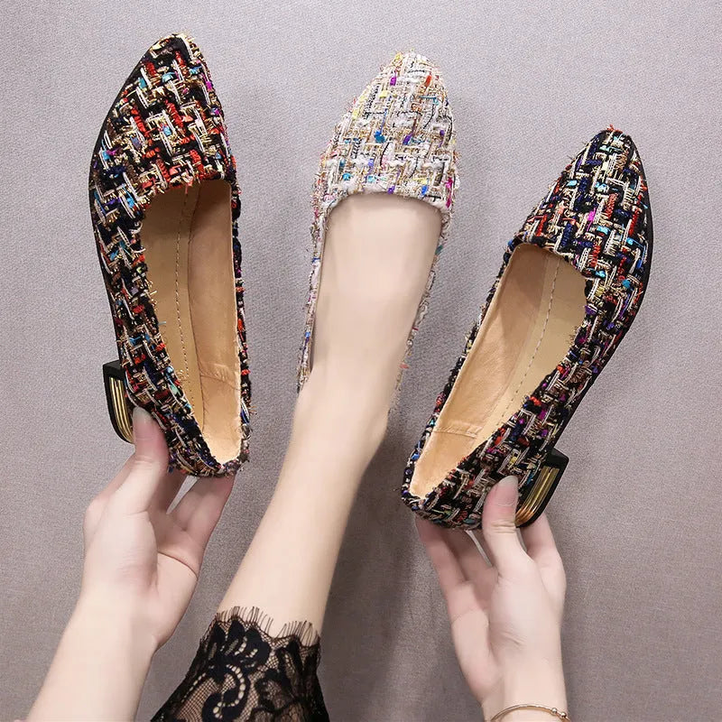 Women's black canvas casual flats with pointed toe and low-cut design on flat rubber sole