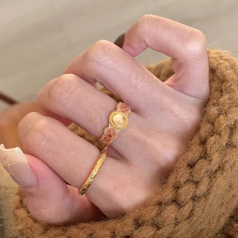 Women's geometric open ring with pink crystal enamel on gold-plated copper band