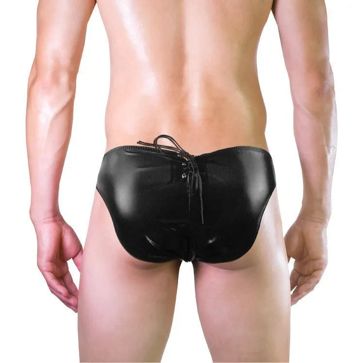 Men's black imitation leather string briefs laid flat showing stretch waist and sleek finish