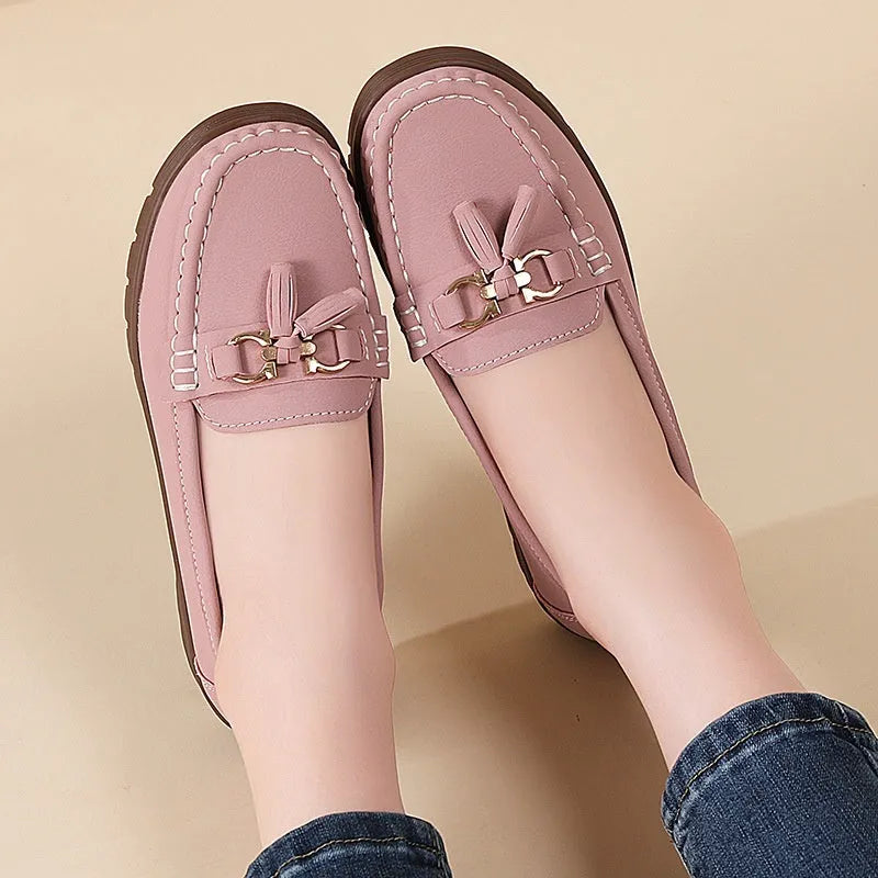 Women's plus size flat moccasins loafers with tassels, round toe, low wedge heel, solid colour suede upper, slip-on style in beige, gray, and pink