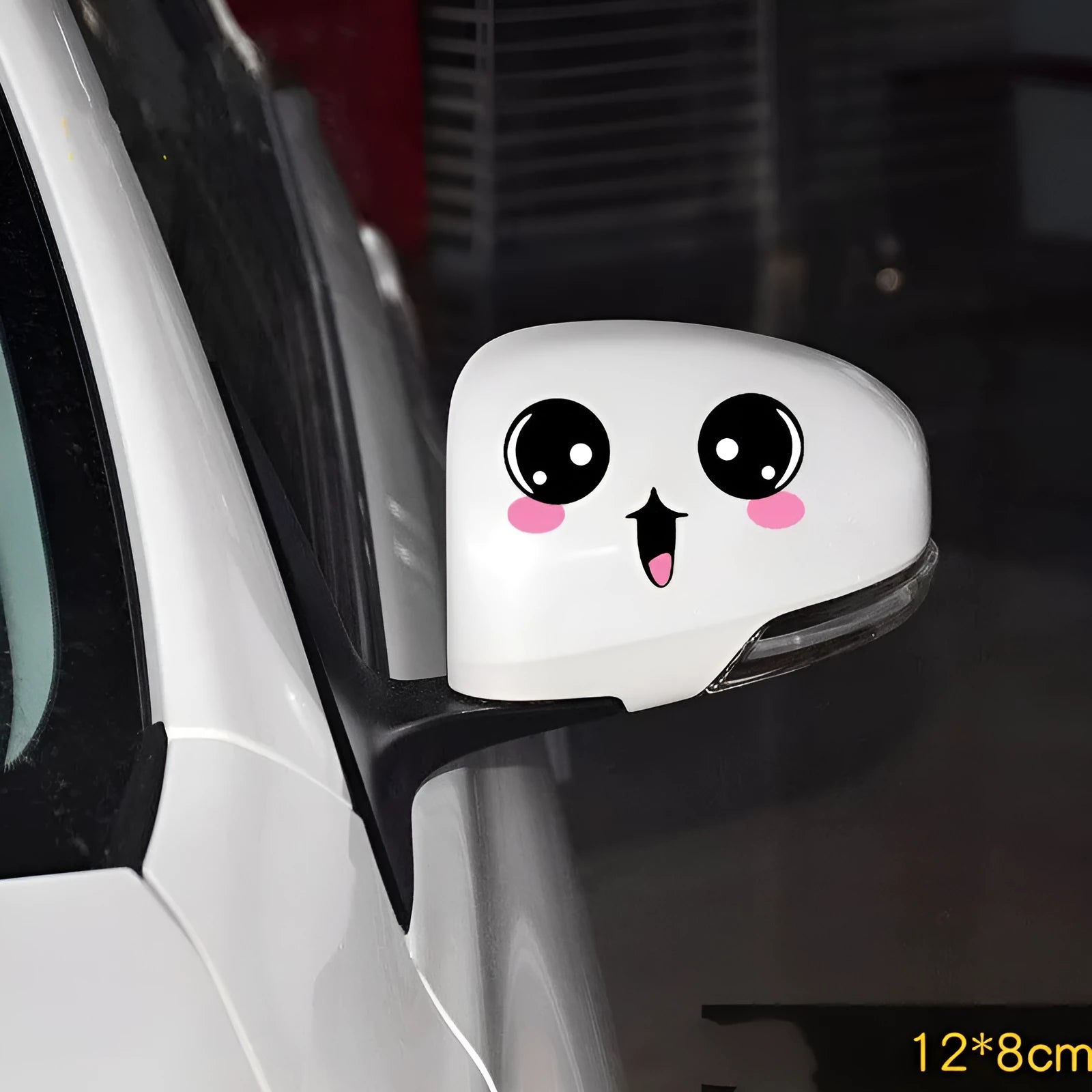 Pair of reflective cartoon eye car stickers on a vehicle rearview mirror and door panel.