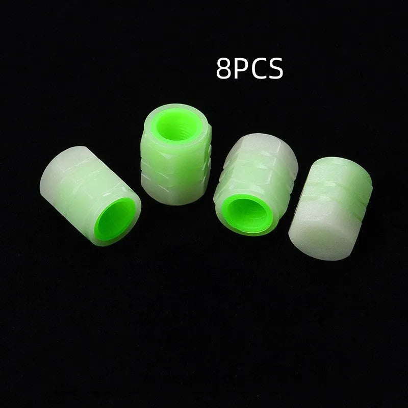 Glow-in-the-dark rubber car valve caps in 16x12mm size showing luminous property