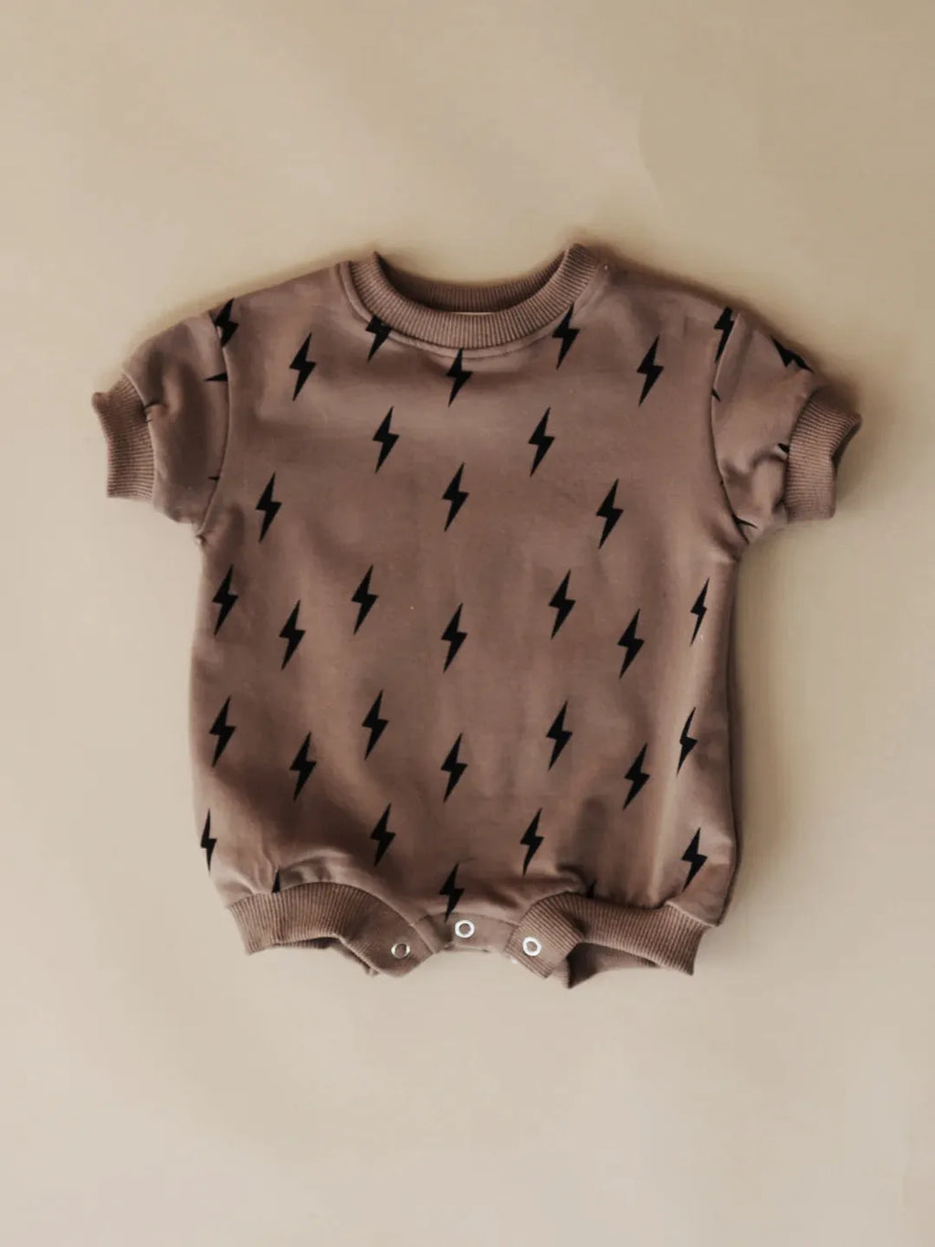 Printed triangle baby romper in cotton wool pull frame fabric with long sleeves and ribbed hem
