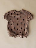 Printed triangle baby romper in cotton wool pull frame fabric with long sleeves and ribbed hem