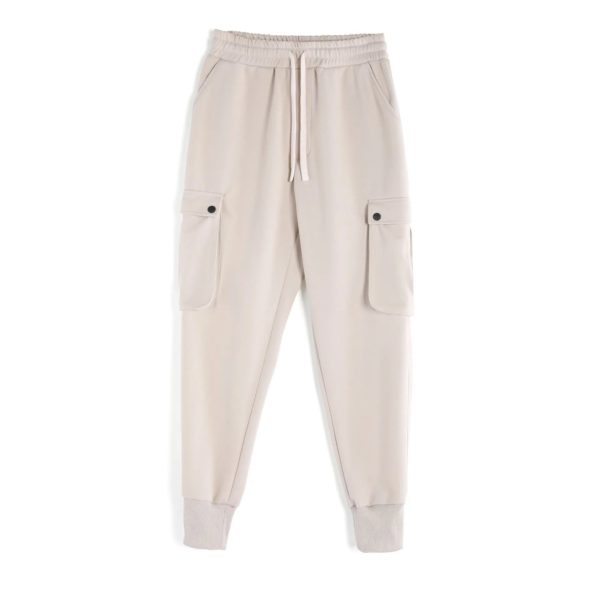 Men's loose-fit beige trousers with ankle ties and multiple pockets, laid flat.