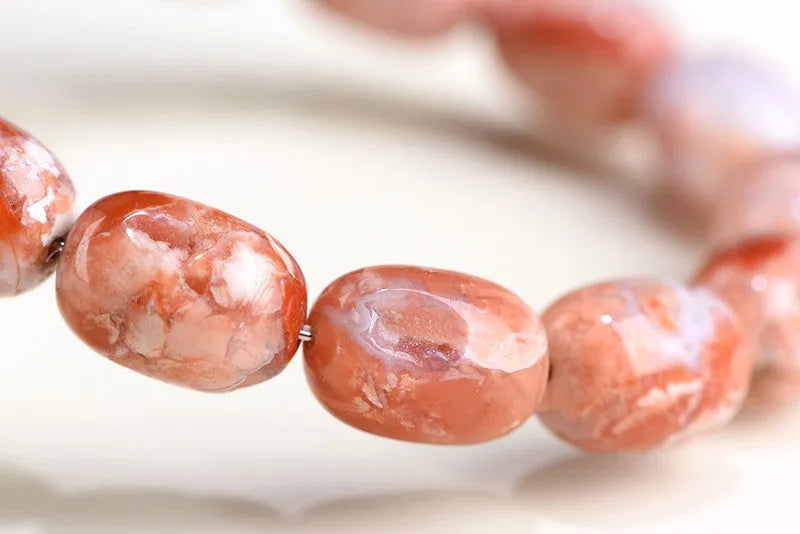 Natural cherry agate barrel bead bracelet with geometric shape and ruyi design elements