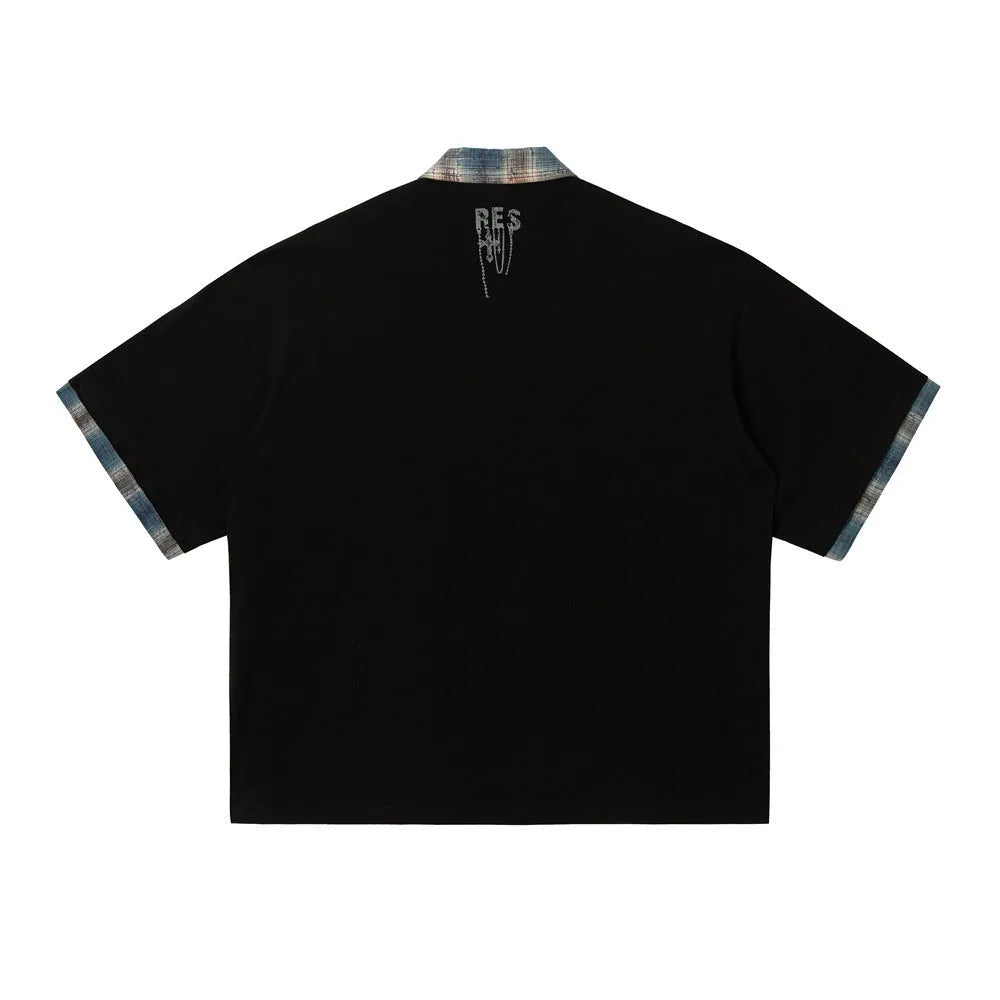 Men's loose blue cotton top with asymmetric lapel and graffiti print, short sleeves.