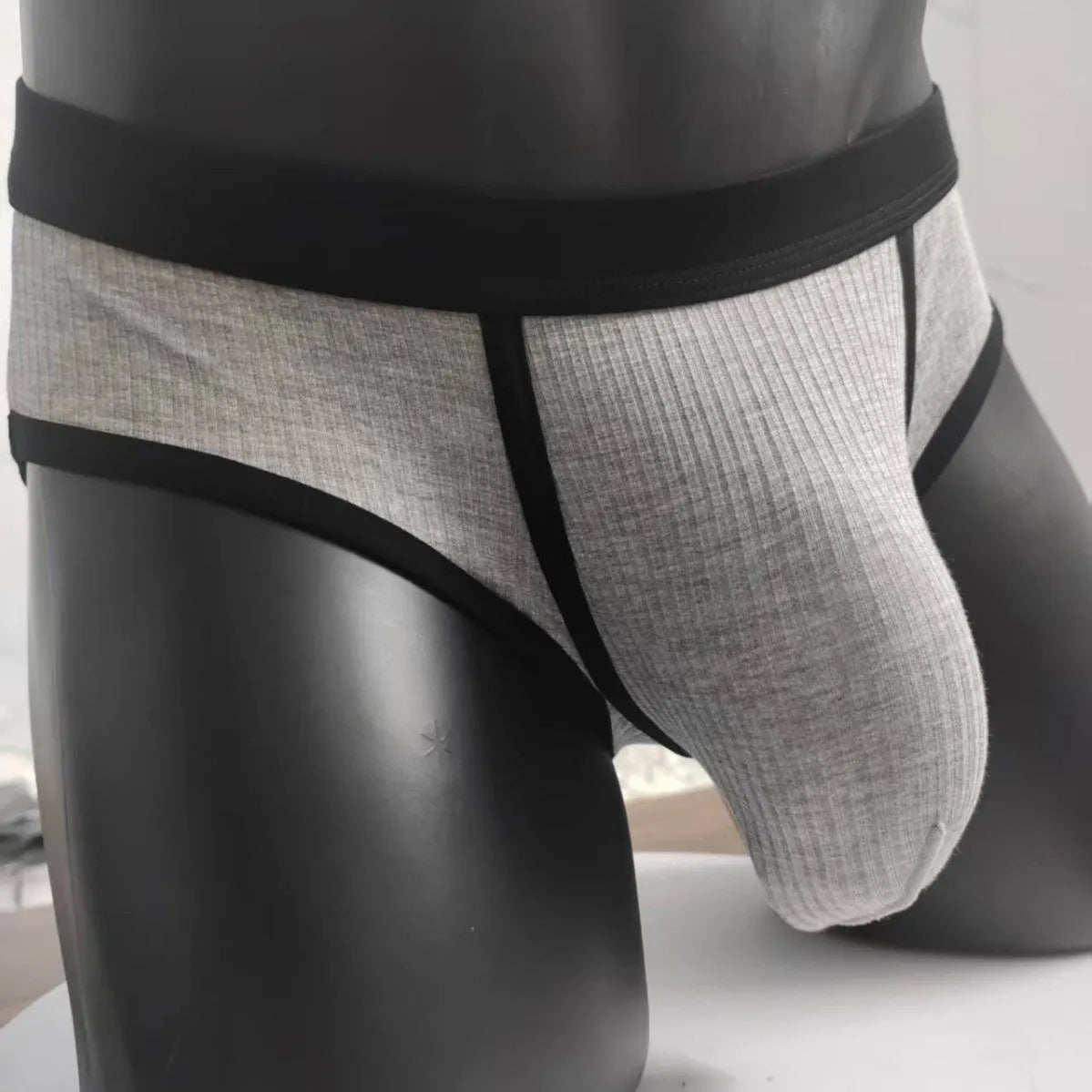 Men's solid colour viscose U-shaped bag briefs on a low waist, shown in multiple colour options.
