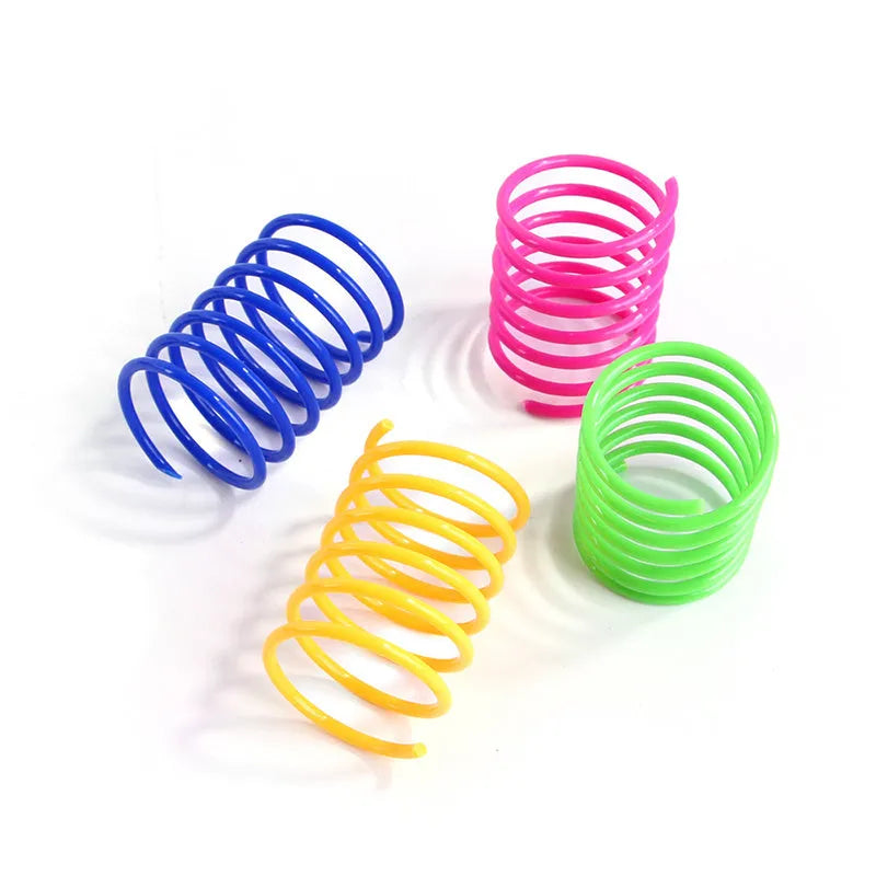 Plastic cat spring toys in mixed colours showing 5.5cm length and 2cm diameter measurements