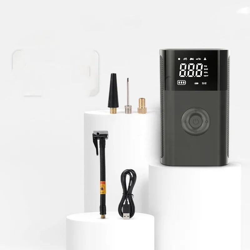 Wireless digital display handheld air pump with LED light, digital screen, and assorted inflation nozzles.