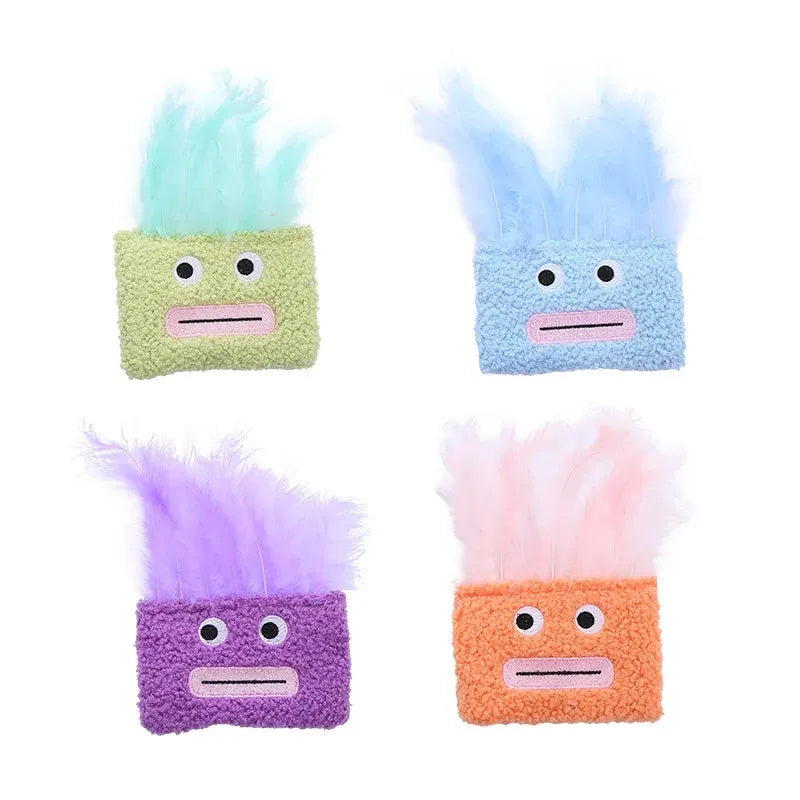 Colourful big mouth explosion head-shaped plush cat toy shown in blue, green, orange, and purple.