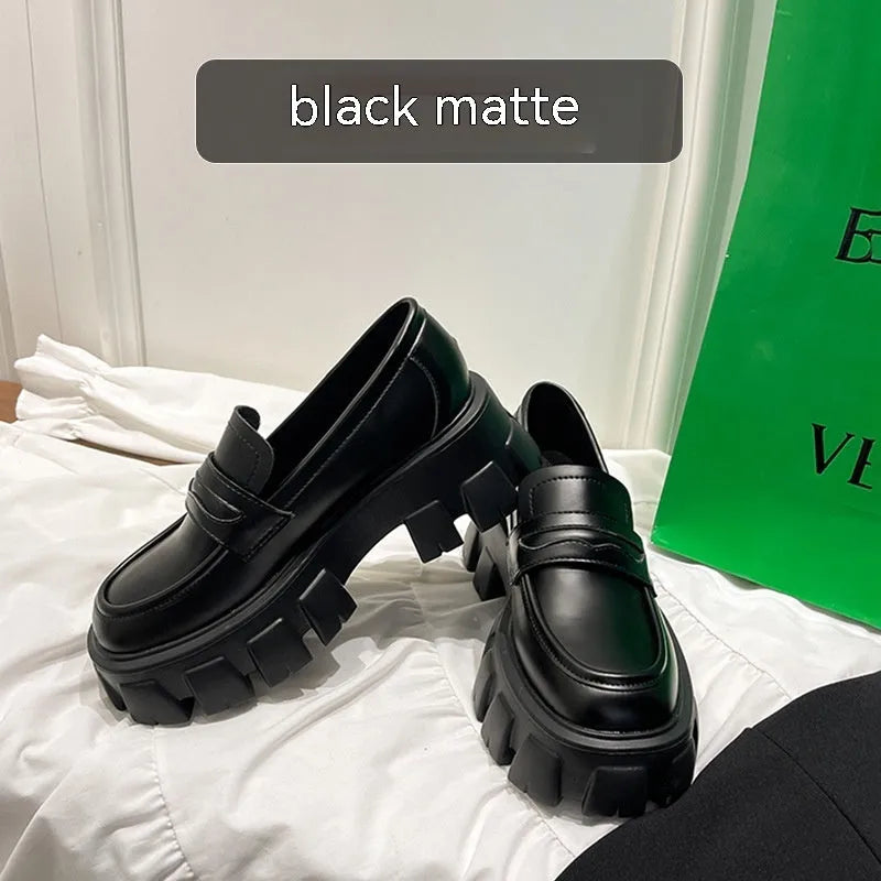 British style wide fit loafers in patent leather and matte finishes on a muffin base rubber sole.