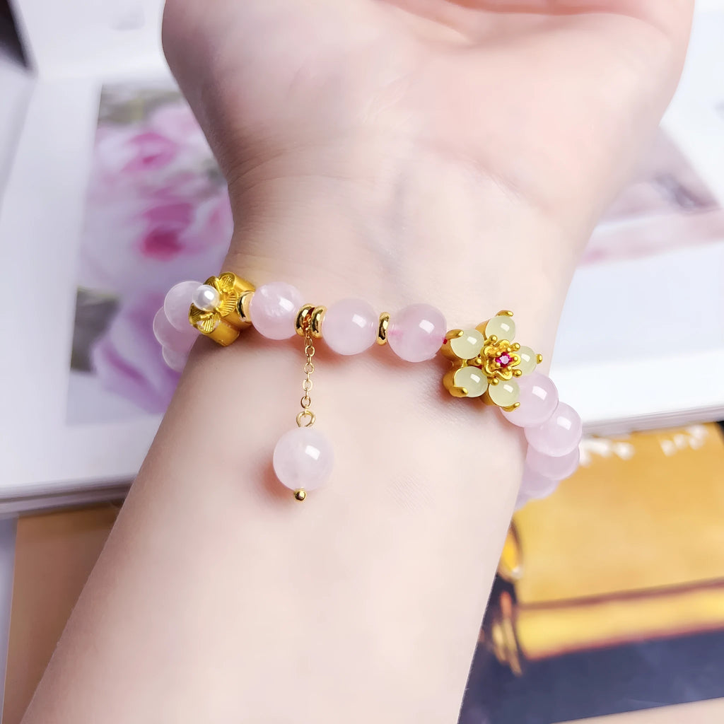 Pink Chinese crystal peach blossom bracelet with adjustable design on wrist