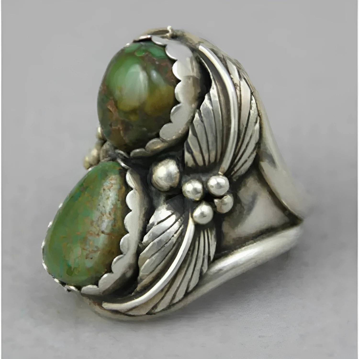 Women's geometric turquoise ring with electroplated alloy construction on finger