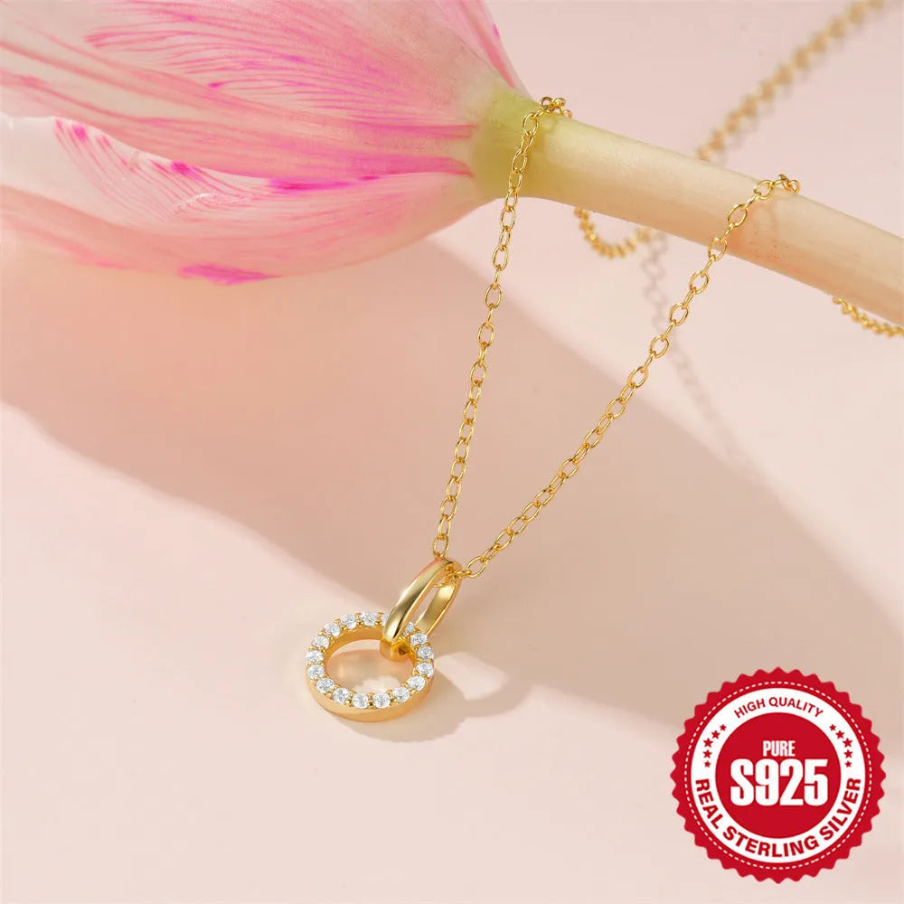 Gold-coloured geometric sterling silver pendant necklace with zircon detail on an adjustable chain.