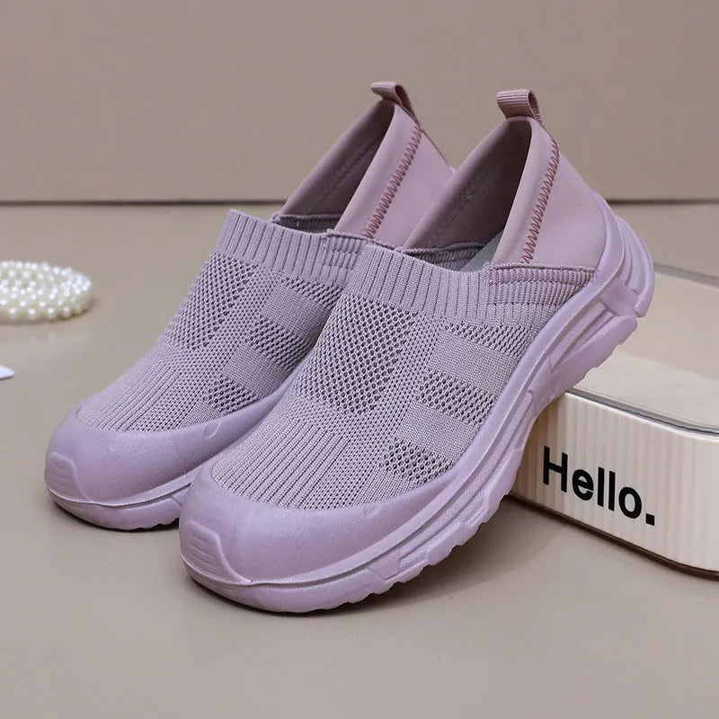 Women's slip-on shoe covers with cloth uppers and PVC soles in black, milky white, and purple colours
