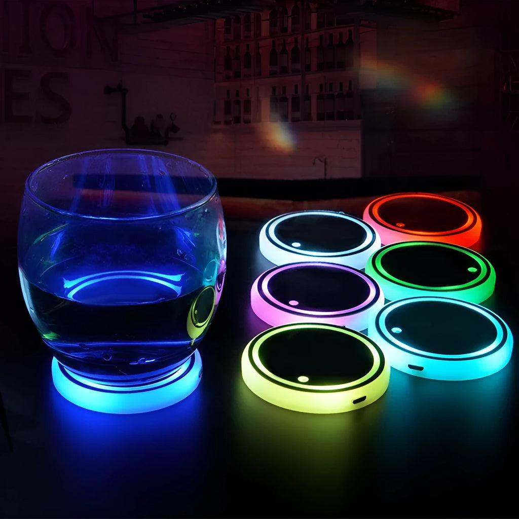 Colourful LED light-up coaster for a car cup holder showing multiple light colours on a 68mm acrylic and ABS mat.