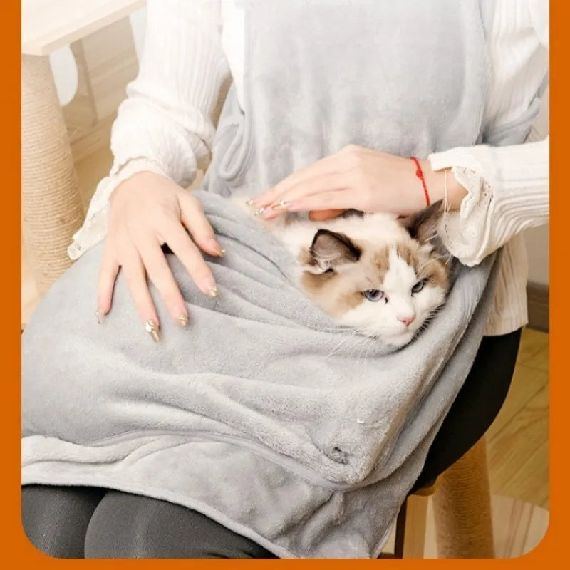 Plush pet carrier apron for small cats and dogs shown in beige, with adjustable neck and head opening.