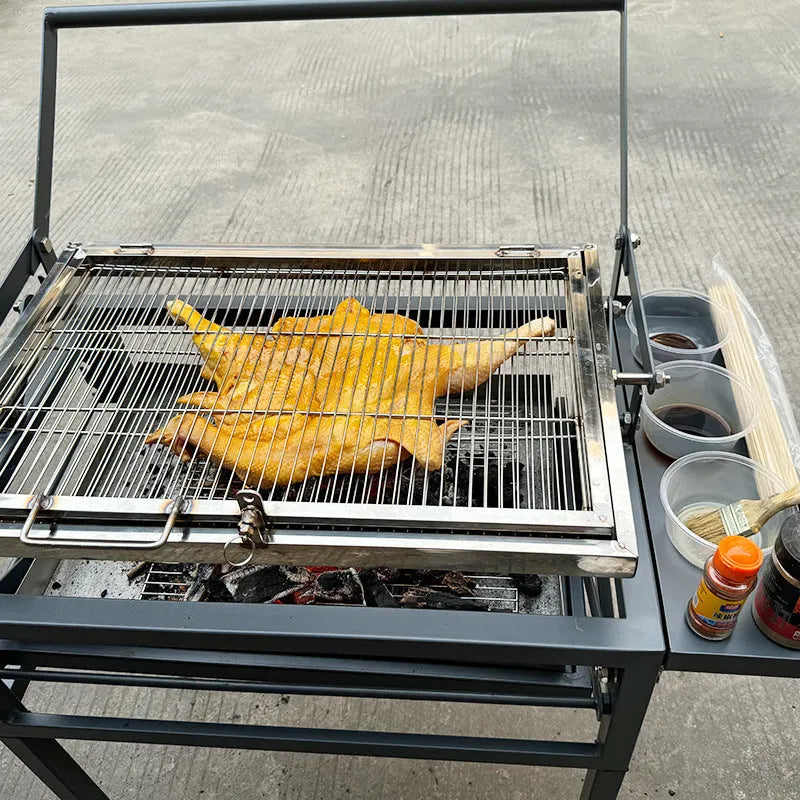 Large foldable portable charcoal BBQ stove with a detachable grill for outdoor cooking.