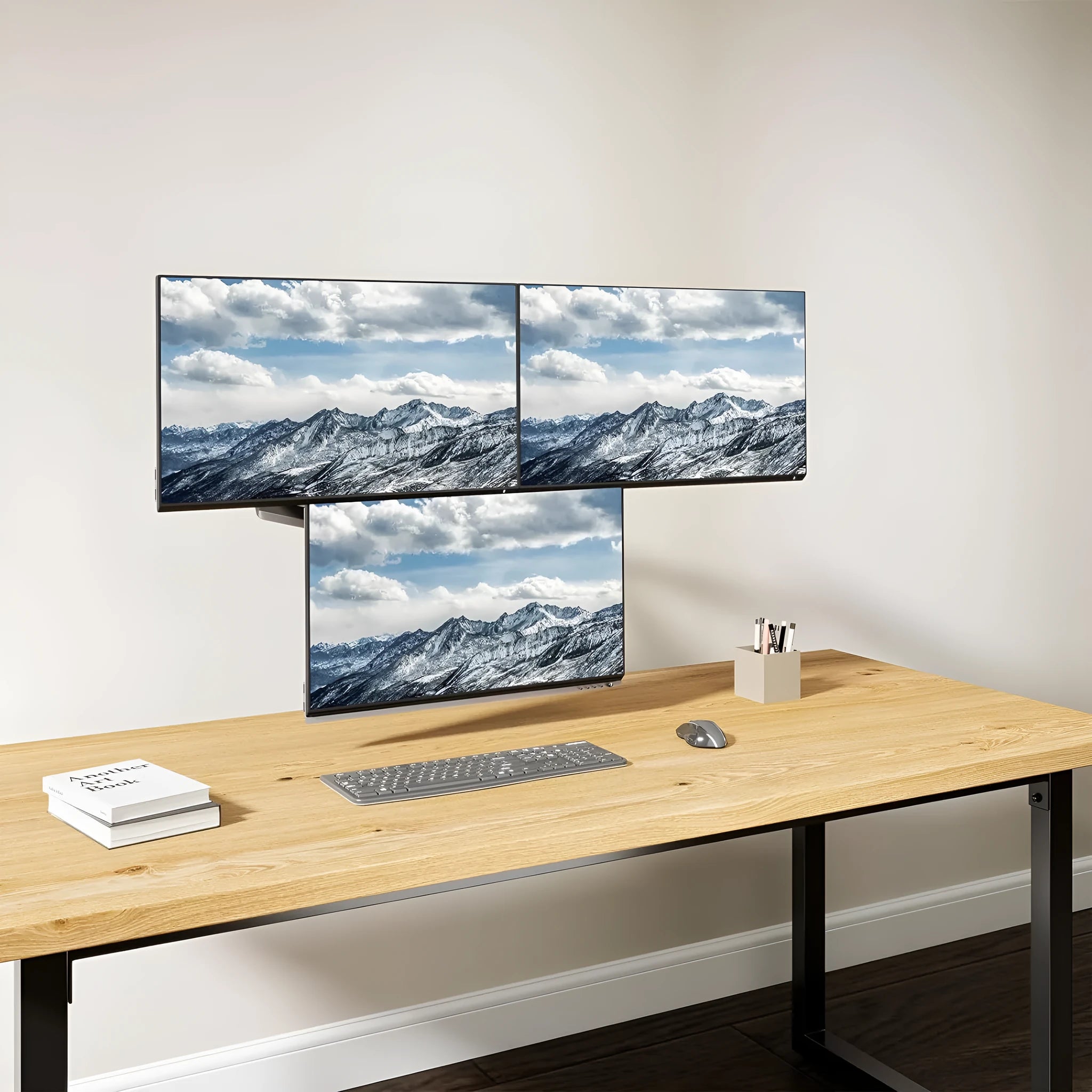 Black aluminium three-arm gas spring monitor mounting arm for 13-27 inch screens.