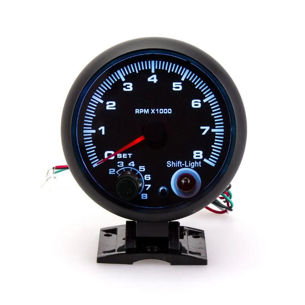 Black automotive digital tachometer with blue laser pointer for engine RPM measurement