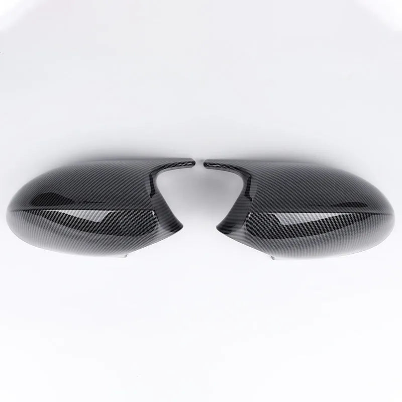 Pair of black ABS plastic rearview mirror shells for BMW 3 Series E90 car.
