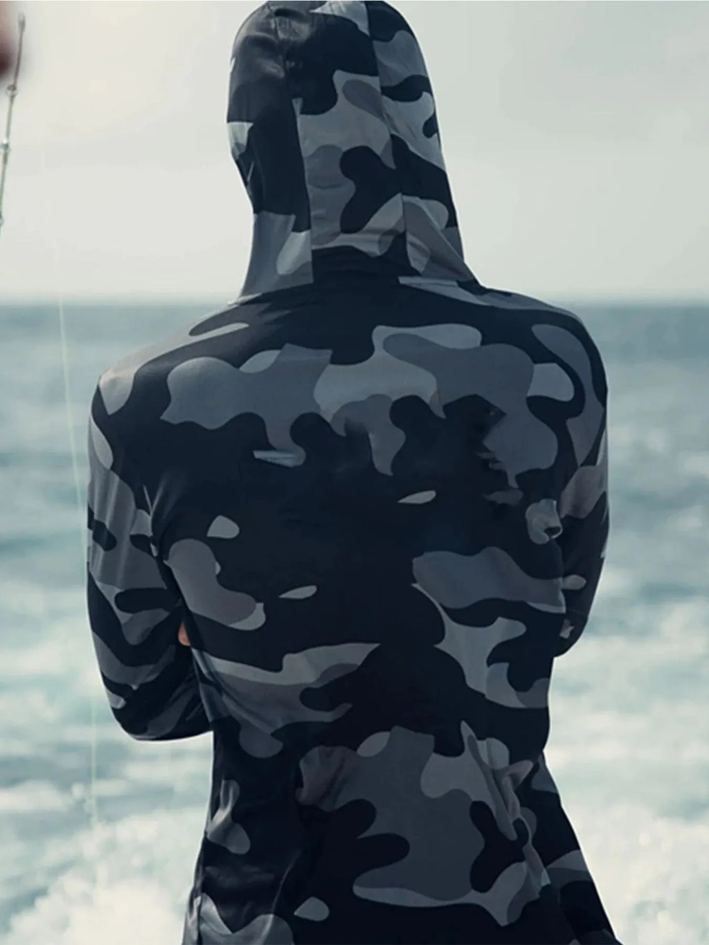 Huk men's grey long sleeve fishing hoodie showing mesh side panels and crew neck.