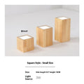 Modern solid wood surface mounted downlight in wood colour, shown in round and square shapes.