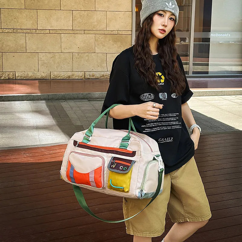 Large capacity sports shoulder messenger bag in black or khaki with 36-55L storage