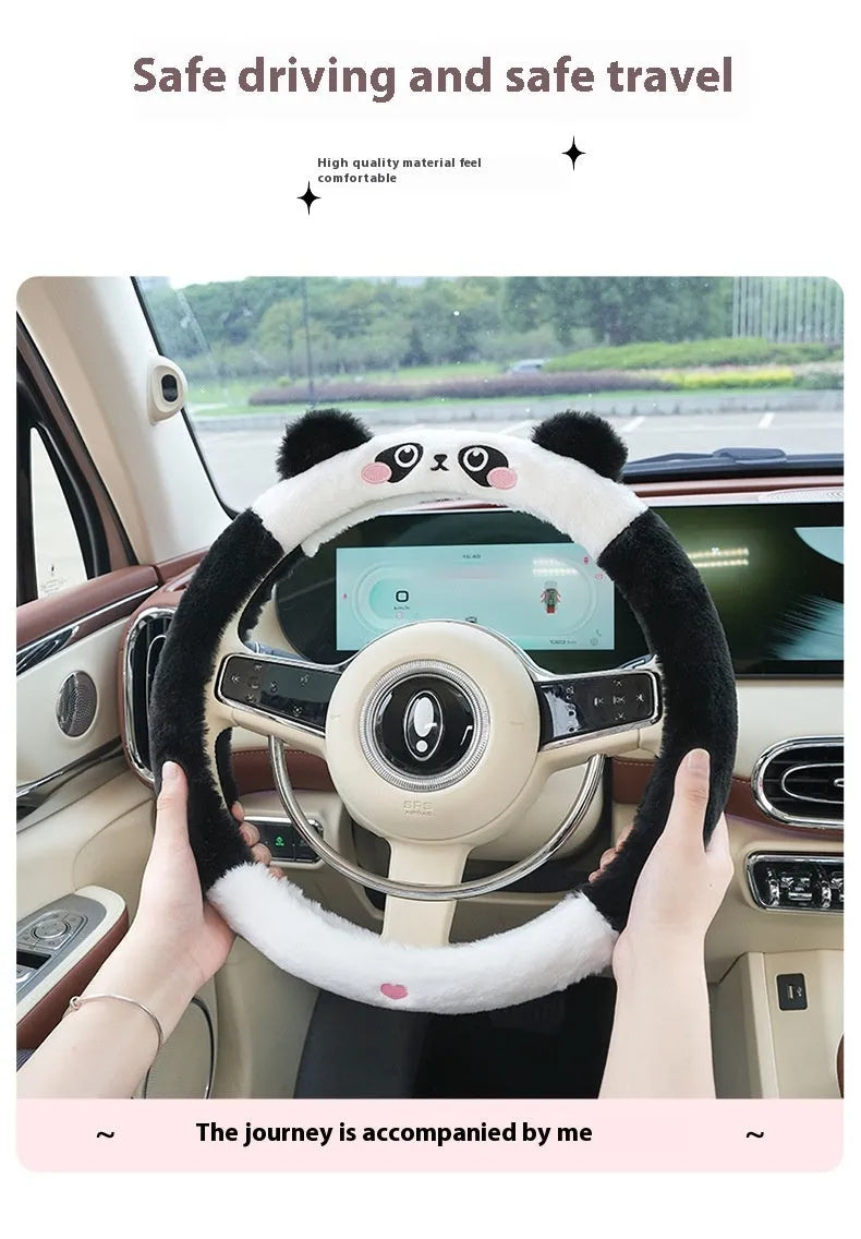 Plush faux fur steering wheel cover with embroidered cartoon bear face, fitted on a car steering wheel