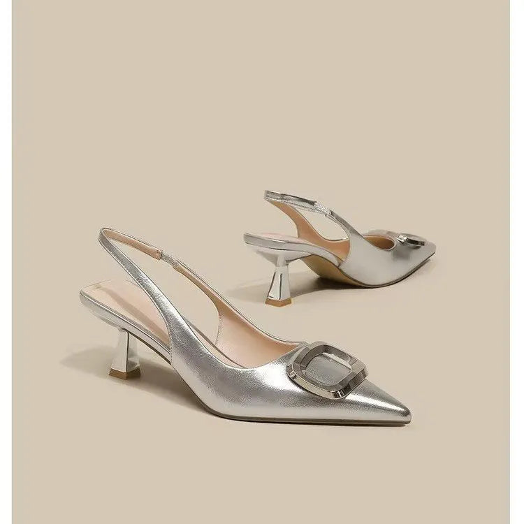 Pointed toe classy high heels with French square buckle in black, cream white, and silver. Microfiber and rubber construction. Sizes 35 to 39.