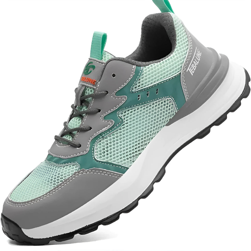Green low-top safety work shoes with a mesh upper, plastic steel toecap, and a slip-on design.