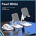 Foldable aluminium alloy phone holder in black on a wooden desk with a smartphone propped up for viewing