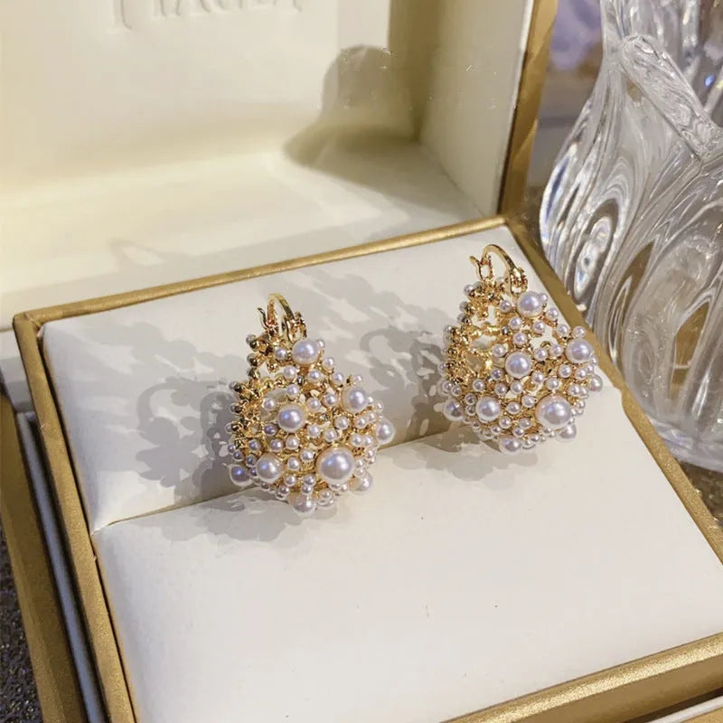 Gold-coloured copper flower basket earrings with small rice-shaped bead inlay for women