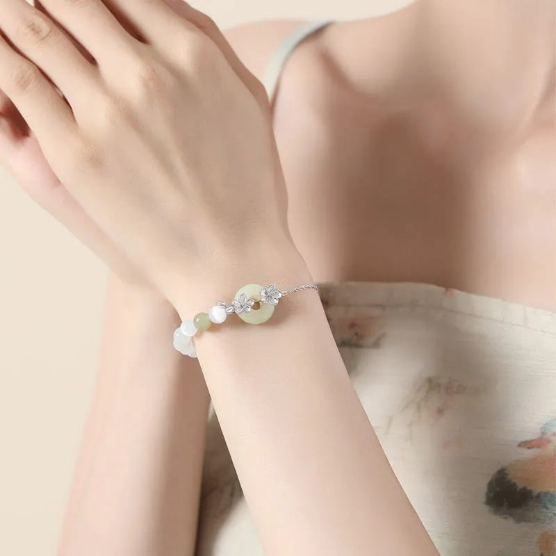 Women's silver bracelet with peach blossom design and safety buckle in New Chinese style jewellery