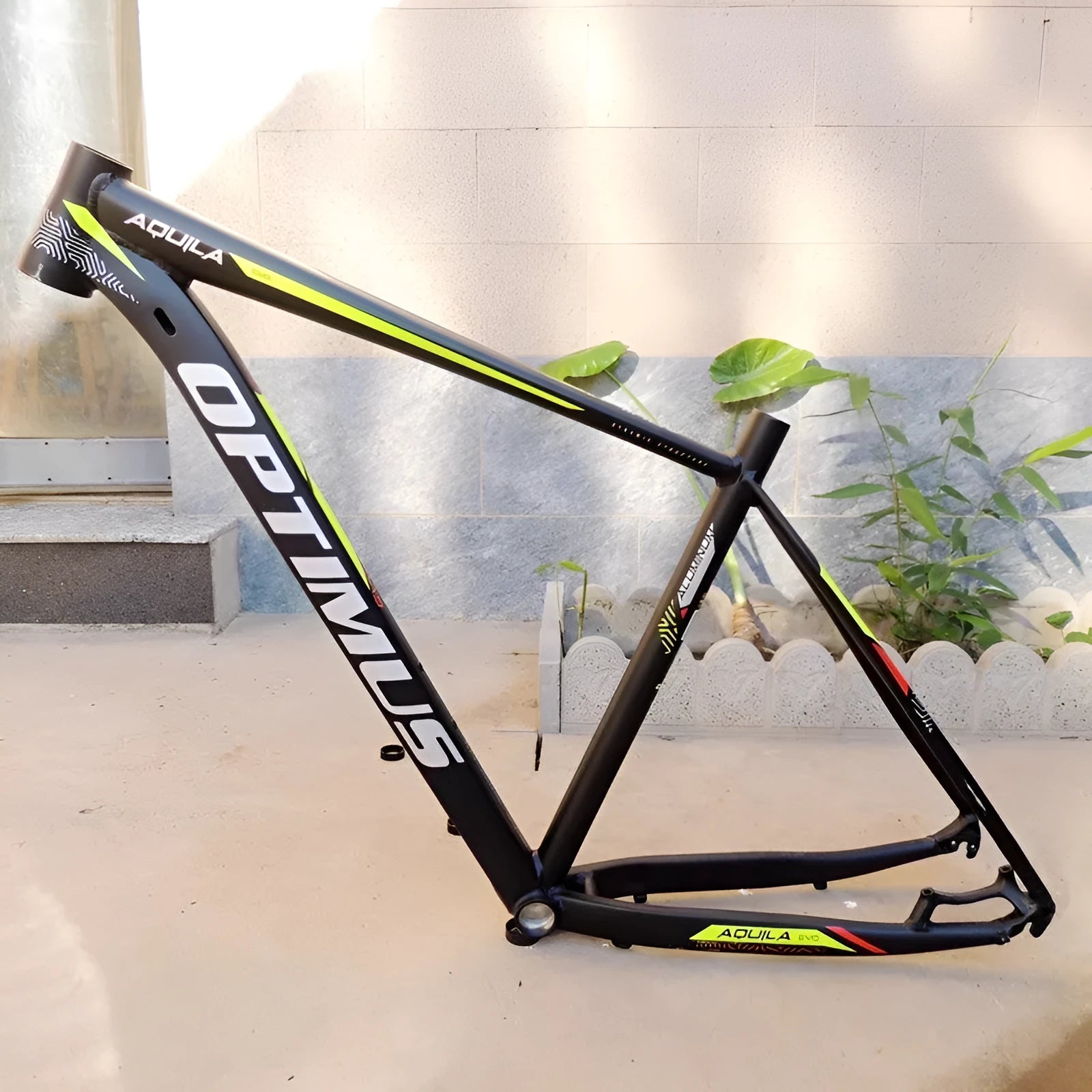 Black green aluminium mountain bike frame with internal cable routing and disc brake mounts
