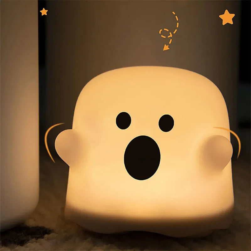Silicone touch sensor LED night light on a bedside table showing soft glow.