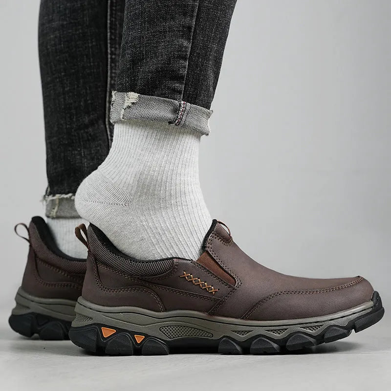 Men's dark brown casual leather shoes with round toe and flat rubber sole.