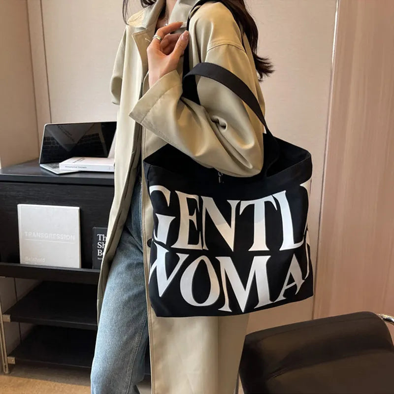 Large capacity canvas tote bag with letter print and upgraded zipper, off-white colour, on plain background